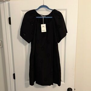 Elegant Black Mini Dress with Eyelet Accents